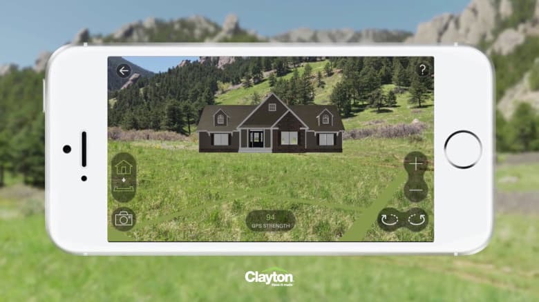 Augmented reality home visualization showing a Clayton Homes model placed within a real-world environment.